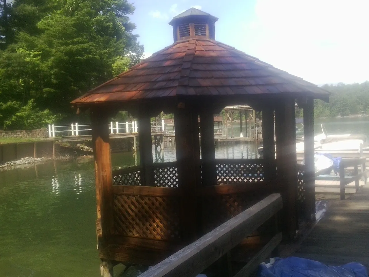 Cedar shake gazebo roof rebuilt on a lake dock in Maysville